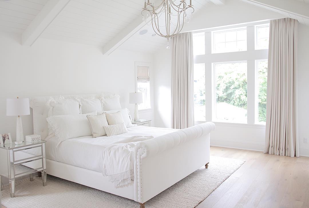 bedroom with white walls and white furniture