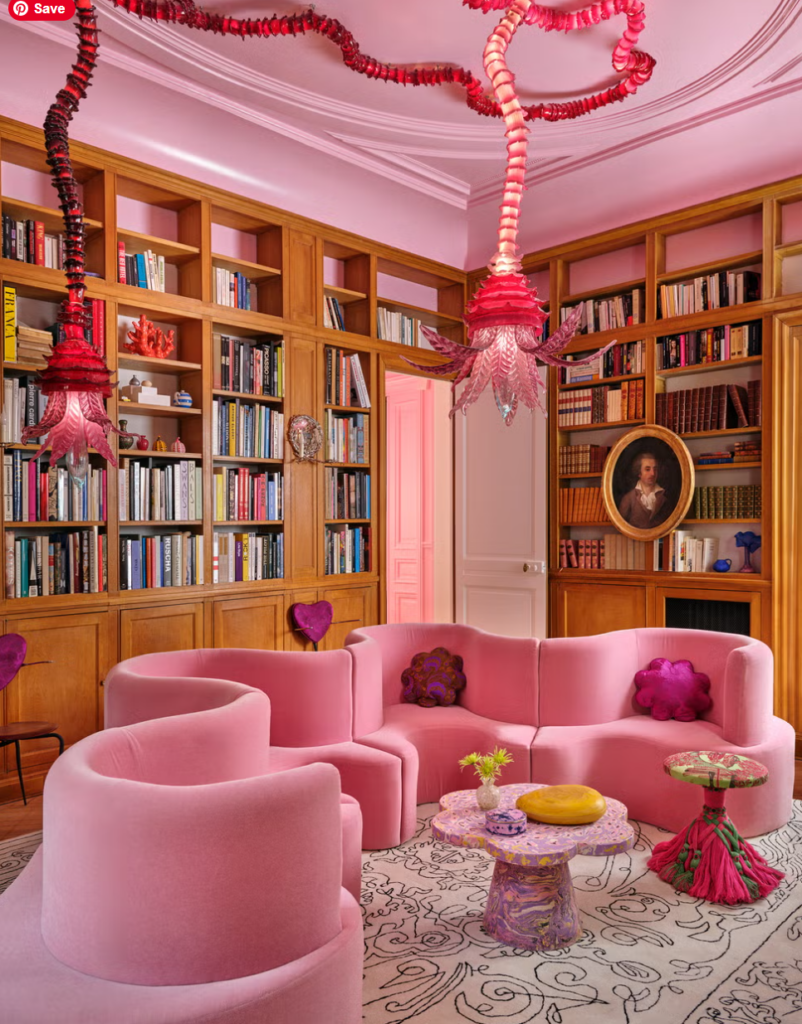 Pink Curved Sofa & Blown Glass Lighting: Maximalist Library Design Ideas