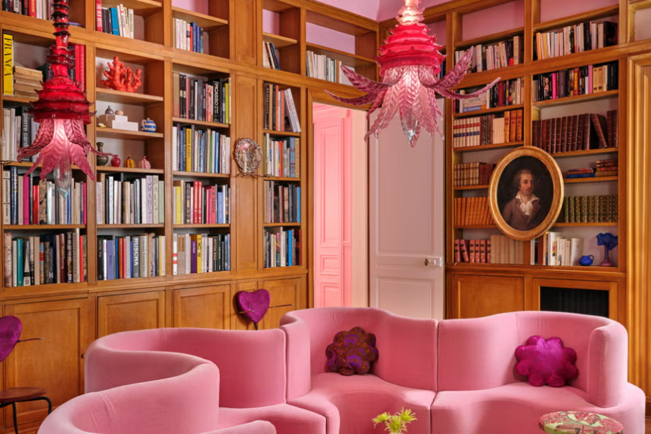 Pink Curved Sofa & Blown Glass Lighting: Maximalist Library Design Ideas